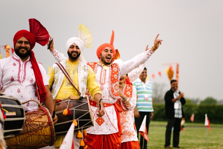 indian traditional dress dancers drummers garlands corporate event