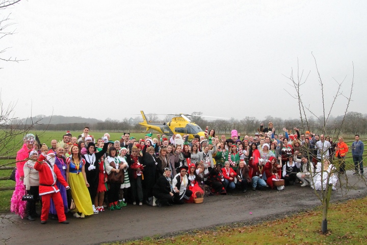 Group Shot with Air Ambulance's in the Background